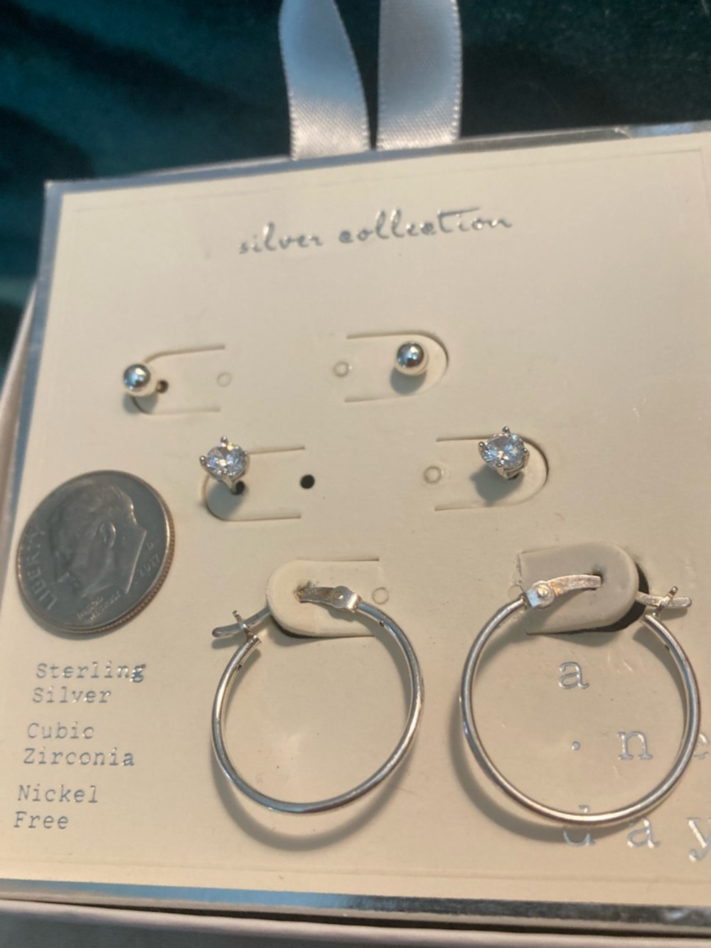 3 pair of new sterling silver and CZ earrings.